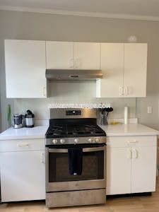 Somerville 3bed/1bath Very sunny spacious Near T front and rear porches new kitchen large backyard area laundry, Driveway avail for $100 month  West Somerville/ Teele Square - $3,850